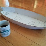 Using the plan purchased from a Montana boat builder, I began by building a scale model.